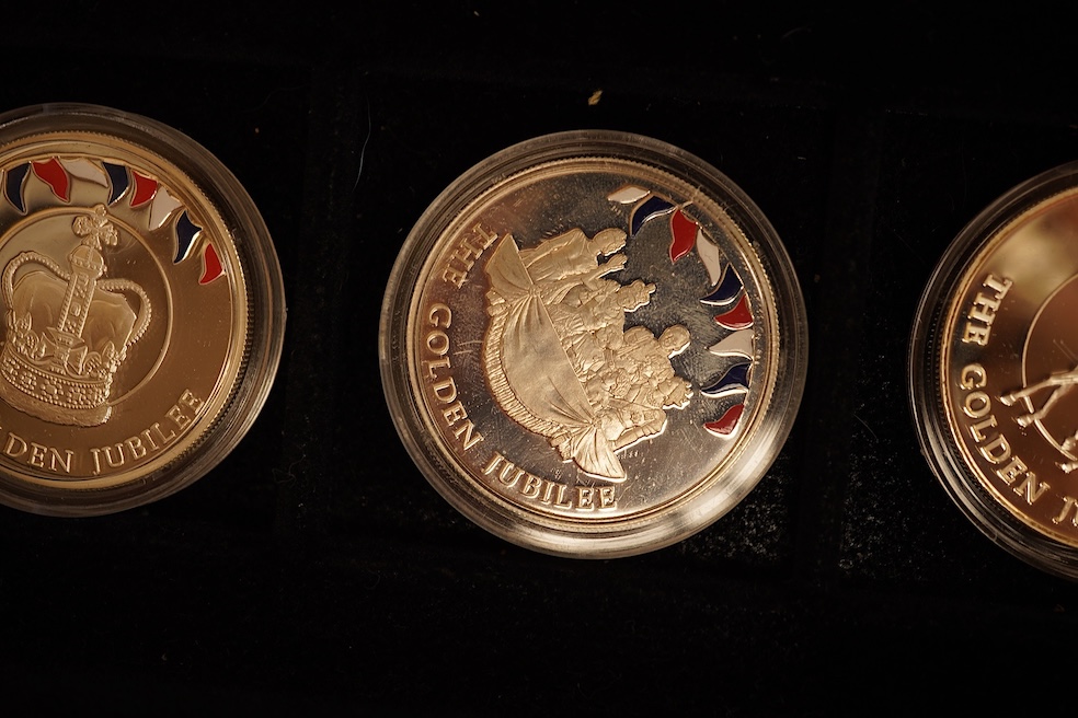 Yorkshire Mint 'Royal Arms Collection' of 12 enamelled silver armorial shields, cased and Westminster Mint 12 QEII Falkland Islands Golden Jubilee proof silver coins, cased (2 cases)